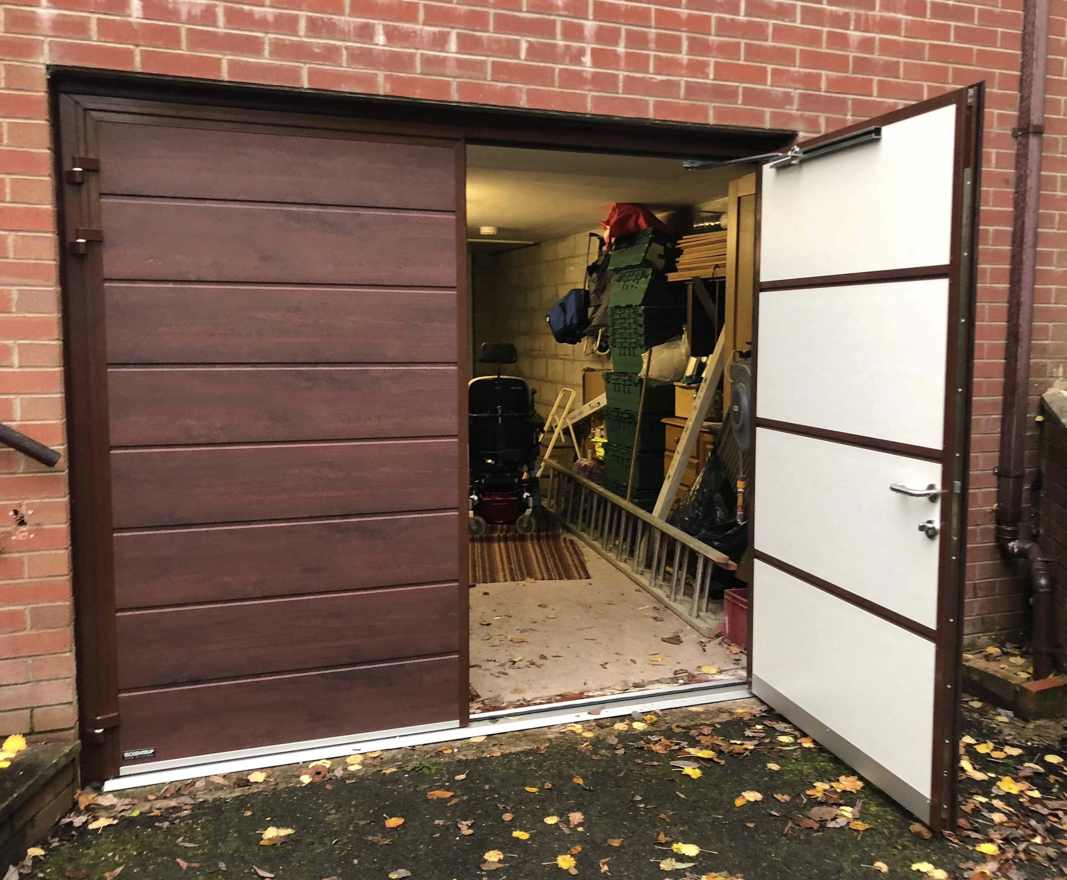 Insulated steel side hinged garage door in rosewood finish